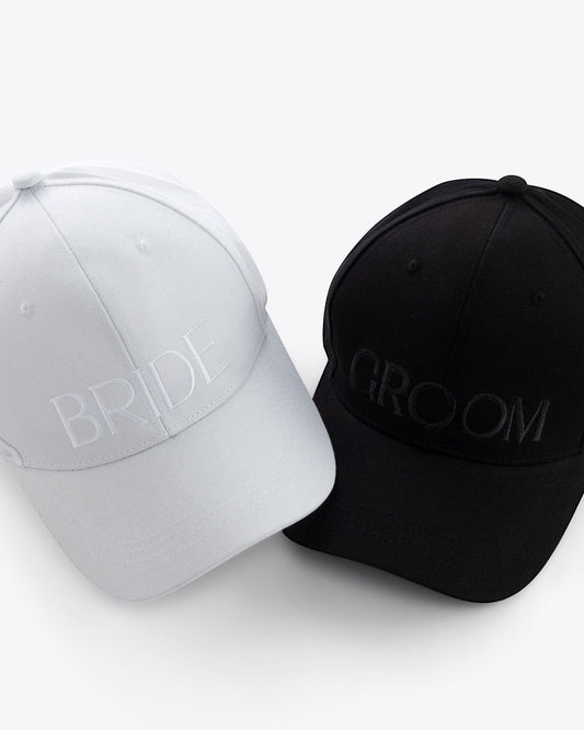 Embroidered Bride and Groom Baseball Hats. The set includes white Bride Baseball Hat and black Groom Baseball Hat.