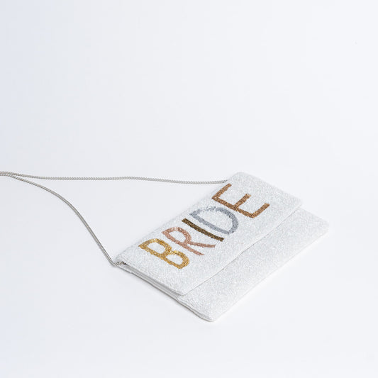 Beaded Bride Purse. Covered in shiny white seed beads, this purse has BRIDE outlined with complementing gold, rose gold, bronze, copper and metallic silver seed beads. Can be accessorized as a clutch or worn as a purse.