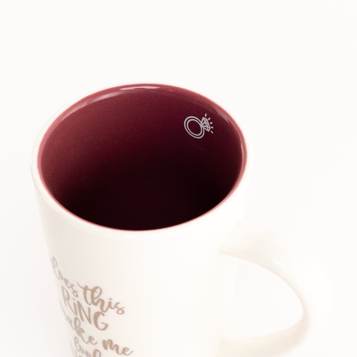 Cute ceramic mug that reads "Does This Ring Make Me Look Engaged?".