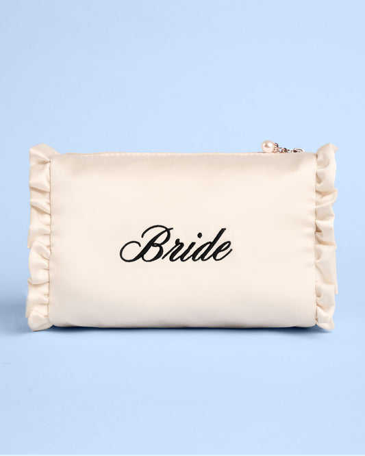 Beige pouch with 'Bride' text on a light blue background