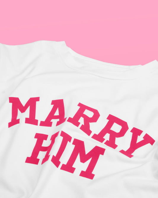 White shirt with 'MARRY HIM' in pink text on a pink background