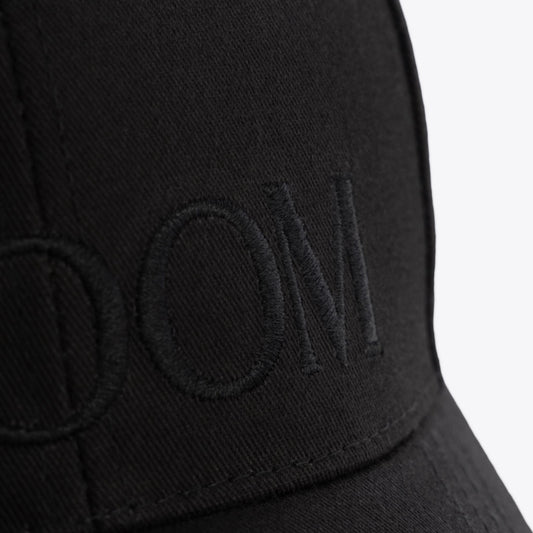 Black-on-black embroidered GROOM baseball hat comes with an adjustable brass buckle. Made of 100% cotton twill.