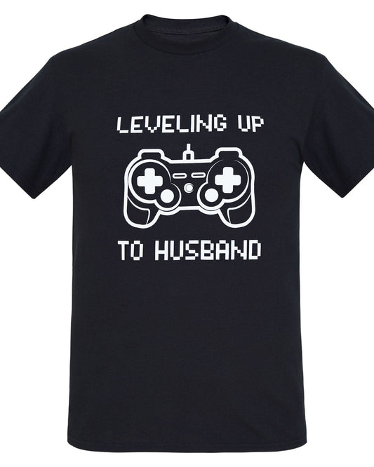 Black Groom T-shirt with a fun print. Leveling Up To Husband and a game controller are printed in white on the front of the t-shirt.