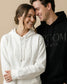 Couple wearing 'Bride' and 'Groom' puff print hoodies. Matching hoodies for Bride and Groom with personalization