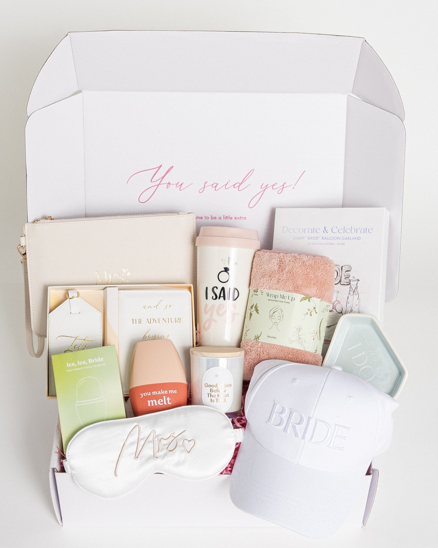 Bride Gift box with various items including a mug, candle, baseball hat, ring dish, and other, packaged in a gift box