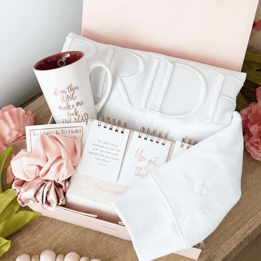 Wedding-themed items, including a Bride sweatshirt, mug, calendar and scrunchies, packaged in a gift box. Bride Gift Box