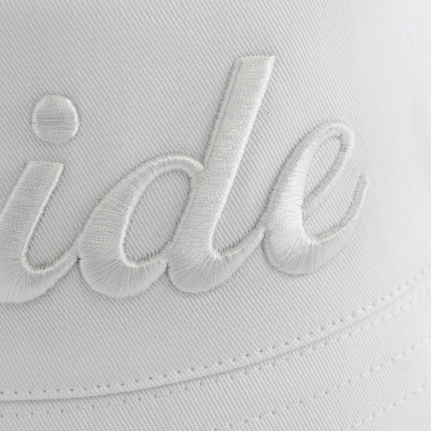 White-on-white embroidered Bride Bucket Hat, made of 100% cotton twill.